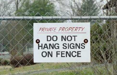 do-not-hang-signs-on-fence-sign